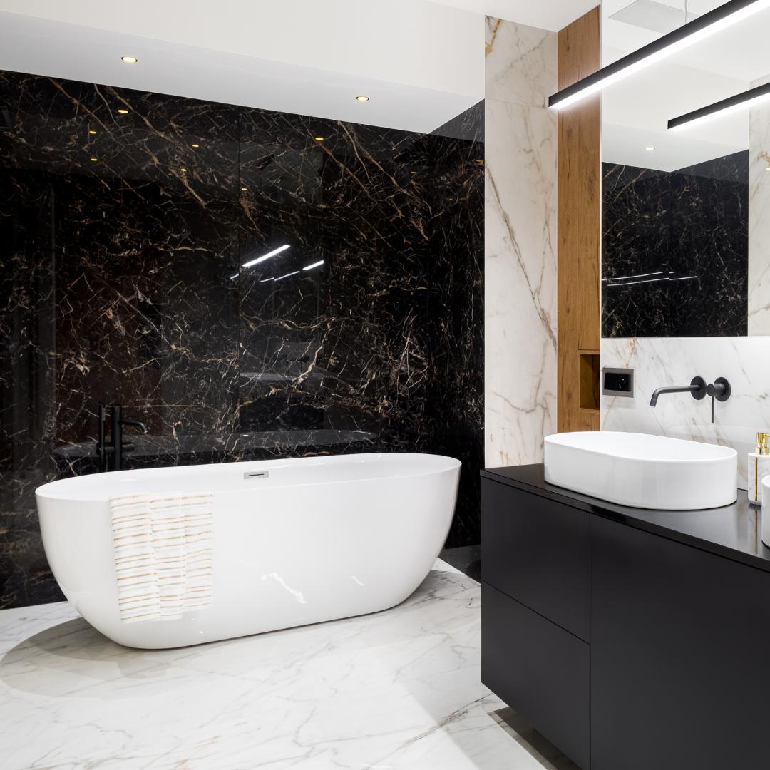 Experience the elegance and sophistication of a black and white bathroom with luxurious marble walls.