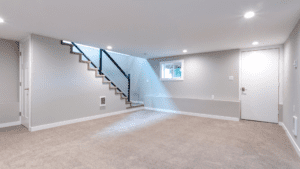 Finished basement with carpet flooring and potlights
